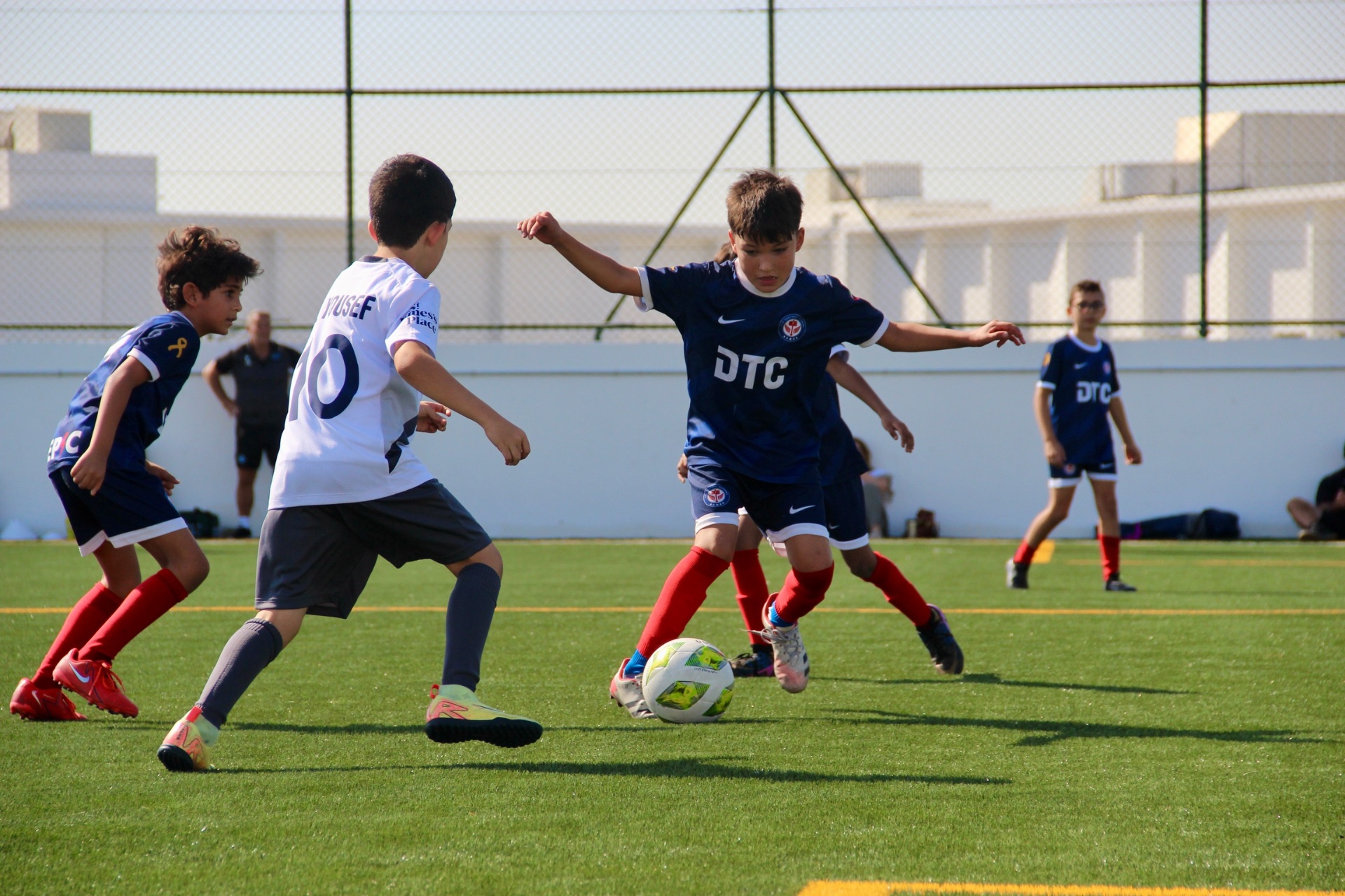 Players aged 11 to 14 competing in a match
